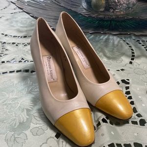Size 8 beige pumps with yellow toe.